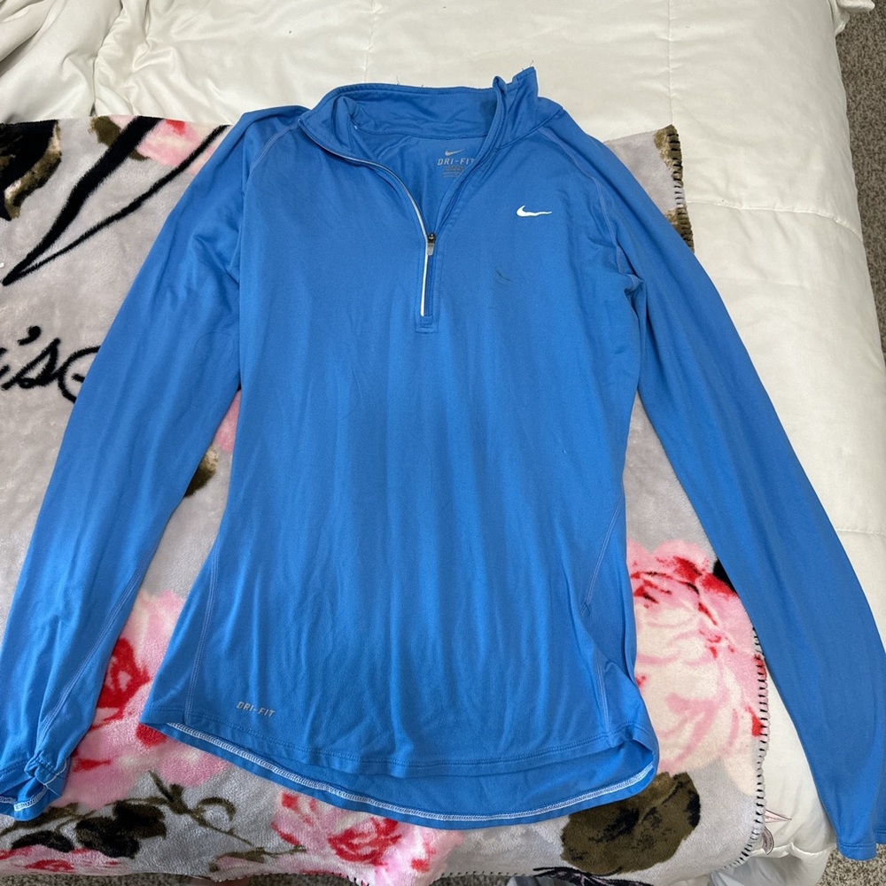 Blue Nike quarter zip athletic top